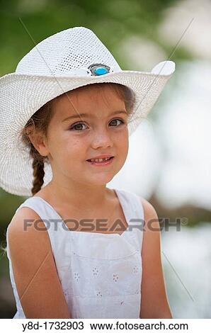 Five years old cowgirl - Cute little girl with braid wearing a white cowboy hat View Large Photo Image Stock Image - Five years old cowgirl - Cute little girl with braid wearing a white cowboy hat. Fotosearch