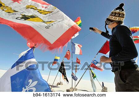 Flags. Salar de Uyuni (or Salar de Tunupa), the world's largest salt flat at 10, 582 square kilometers. It is located in the Potos? and Oruro departments in southwest Bolivia, near the crest of the Andes View Large Photo Image Picture - Flags. Salar de Uyuni (or Salar de Tunupa), the world's largest salt flat at 10, 582 square kilometers. It is located in the Potos? and Oruro departments in southwest Bolivia, near the crest of the Andes. Fotosearch