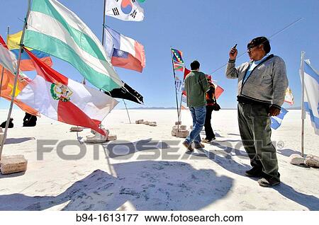 Flags. Salar de Uyuni (or Salar de Tunupa), the world's largest salt flat at 10, 582 square kilometers. It is located in the Potos? and Oruro departments in southwest Bolivia, near the crest of the Andes View Large Photo Image Stock Photo - Flags. Salar de Uyuni (or Salar de Tunupa), the world's largest salt flat at 10, 582 square kilometers. It is located in the Potos? and Oruro departments in southwest Bolivia, near the crest of the Andes. Fotosearch