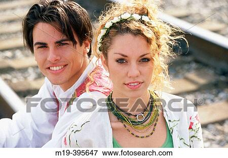flambouantly dressed young couple View Large Photo Image Stock Photo - flambouantly dressed young couple. Fotosearch