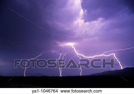 Picture - flashes of lightnings during a thunderstorm, Saint girons, France, Ariege. Fotosearch