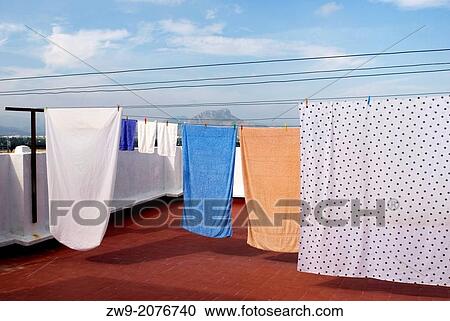 Flat roof with laundry hanging on clothelines, Denia, Alicante, Comunidad Valenciana, Costa Blanca, Spain View Large Photo Image Stock Image - Flat roof with laundry hanging on clothelines, Denia, Alicante, Comunidad Valenciana, Costa Blanca, Spain. Fotosearch