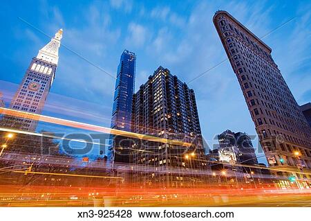 Stock Photo - Flatiron building on the roght, Fifth avenue, Manhattan, New York, USA. Fotosearch