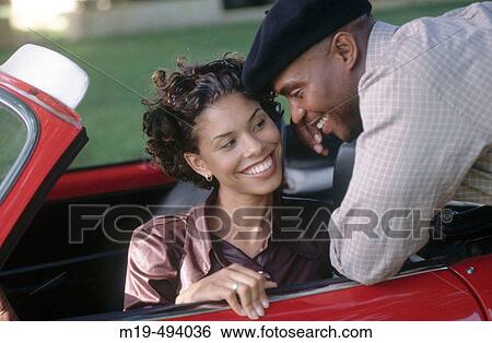 flirting with a girl in a car View Large Photo Image Stock Photograph - flirting with a girl in a car. Fotosearch