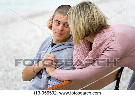 Flirting young couple View Large Photo Image Stock Image - Flirting young couple. Fotosearch
