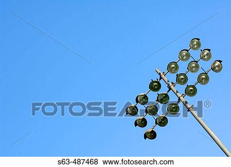 Floodlights in a sports stadium against clear blue sky View Large Photo Image Stock Photo - Floodlights in a sports stadium against clear blue sky. Fotosearch