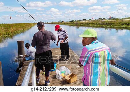Florida, Fort Ft Lauderdale, Everglades, Alligator Alley, Black, woman, man, fishing, water,. View Large Photo Image Stock Photo - Florida, Fort Ft Lauderdale, Everglades, Alligator Alley, Black, woman, man, fishing, water,.. Fotosearch