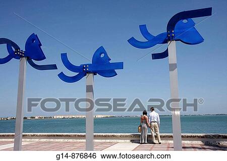 Stock Photograph - Florida, Fort Ft. Pierce, Indian River, Gazebo Park, steel, sculpture, In the Swim, Jorge Blanco, artist, Art in Public Places, man, woman, couple, holding hands, water,. Fotosearch
