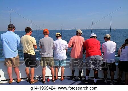 Florida, Miami Beach, Atlantic Ocean, water, charter fishing boat, onboard, Black, man, waiting, rods, deep sea, standing room only,. View Large Photo Image Picture - Florida, Miami Beach, Atlantic Ocean, water, charter fishing boat, onboard, Black, man, waiting, rods, deep sea, standing room only,.. Fotosearch