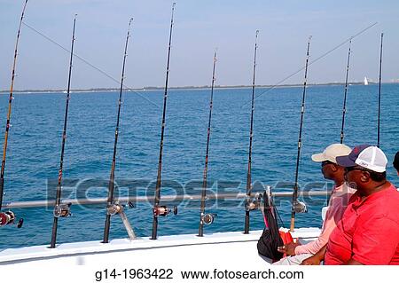 Florida, Miami Beach, Atlantic Ocean, water, charter fishing boat, onboard, Black, man, rods, deep sea,. View Large Photo Image Stock Image - Florida, Miami Beach, Atlantic Ocean, water, charter fishing boat, onboard, Black, man, rods, deep sea,.. Fotosearch