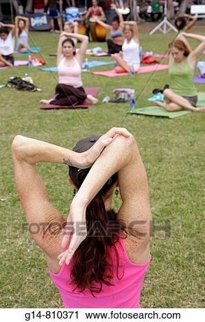 Florida, Miami Beach, Flamingo Park, Crunch Yogapalooza, vinyasa yoga, woman, women, exercise, fitness, stretch, mat, posture, wellness, shoulder, elbow, class, instructor, View Large Photo Image Stock Image - Florida, Miami Beach, Flamingo Park, Crunch Yogapalooza, vinyasa yoga, woman, women, exercise, fitness, stretch, mat, posture, wellness, shoulder, elbow, class, instructor,. Fotosearch