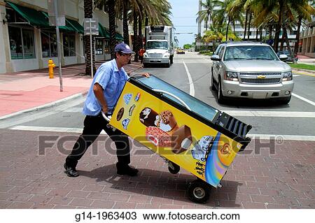Florida, Miami Beach, Hispanic, man, job, working, freezer case, ice cream, desserts, dolly, cart, pushing, across street, traffic,. View Large Photo Image Stock Image - Florida, Miami Beach, Hispanic, man, job, working, freezer case, ice cream, desserts, dolly, cart, pushing, across street, traffic,.. Fotosearch
