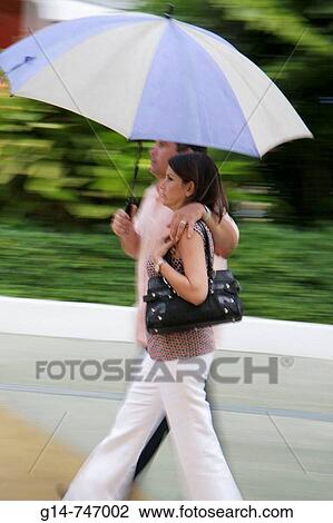 Florida, Miami Beach, Lincoln Road, couple with umbrella View Large Photo Image Stock Image - Florida, Miami Beach, Lincoln Road, couple with umbrella. Fotosearch