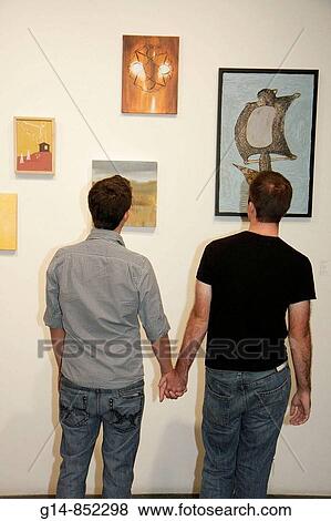 Florida, Miami Beach, Lincoln Road, ArtCenter South Florida, gallery opening, art, exhibit, exhibition, painting, canvas, looking, look, gay couple, homosexual, man, men, hold hands, View Large Photo Image Stock Photo - Florida, Miami Beach, Lincoln Road, ArtCenter South Florida, gallery opening, art, exhibit, exhibition, painting, canvas, looking, look, gay couple, homosexual, man, men, hold hands,. Fotosearch