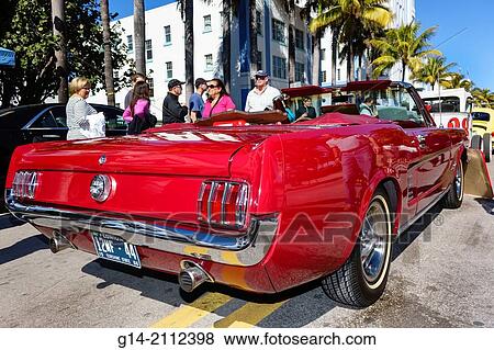 Stock Photo - Florida, Miami Beach, Ocean Drive, Art Deco Weekend, festival, street fair, event, antique classic car automobile show, 1966 Ford Mustang convertible, rear, tail lights, bumper,.. Fotosearch
