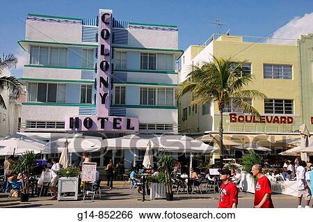 Florida, Miami Beach,? Ocean Drive?, New Year's Day, Art Deco District, Colony Hotel, sidewalk cafe, restaurant, umbrellas, alfresco, al fresco, dining, tables, pedestrian, man, men, palm tree, stroll, walk, sign, half price, 50%, 2x1, 2 for 1, View Large Photo Image Stock Photograph - Florida, Miami Beach,? Ocean Drive?, New Year's Day, Art Deco District, Colony Hotel, sidewalk cafe, restaurant, umbrellas, alfresco, al fresco, dining, tables, pedestrian, man, men, palm tree, stroll, walk, sign, half price, 50%, 2x1, 2 for 1,. Fotosearch