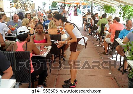 Florida, Miami Beach, Ocean Drive, restaurant, alfresco, dining, Hispanic, woman, waitress, job, taking order, service, Black, tables,. View Large Photo Image Stock Photography - Florida, Miami Beach, Ocean Drive, restaurant, alfresco, dining, Hispanic, woman, waitress, job, taking order, service, Black, tables,.. Fotosearch