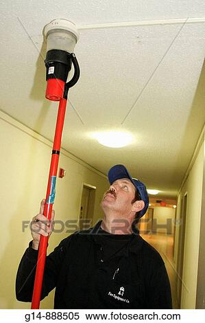 Florida, Miami Beach,? Ocean Drive?, Presidential Condominiums, fire alarm inspection, smoke tube, smoke detector, hallway, man, worker, technician, testing, safety, View Large Photo Image Stock Photography - Florida, Miami Beach,? Ocean Drive?, Presidential Condominiums, fire alarm inspection, smoke tube, smoke detector, hallway, man, worker, technician, testing, safety,. Fotosearch