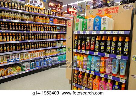 Stock Photo - Florida, Miami Beach, Walgreens, pharmacy, drugstore, shelves, for sale, competing brands, packaging, retail display, sunscreen, sunblock, sun tan lotion, Hawaiian Tropic, shopping,.. Fotosearch