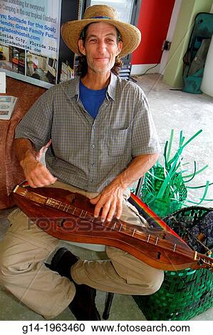 Florida, Miami, Homestead, Harvest Farmers Market at Verde Gardens, mountain dulcimer, man, playing, musician,. View Large Photo Image Stock Image - Florida, Miami, Homestead, Harvest Farmers Market at Verde Gardens, mountain dulcimer, man, playing, musician,.. Fotosearch