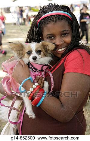 Florida, Miami, Legion Park, Dogs On The Catwalk, dog, fashion, Black, girl, pet, toy dog, papillon, hug, bangles, braids, headband, View Large Photo Image Stock Image - Florida, Miami, Legion Park, Dogs On The Catwalk, dog, fashion, Black, girl, pet, toy dog, papillon, hug, bangles, braids, headband,. Fotosearch