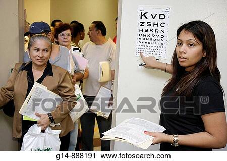 Florida, Miami, Liberty City, Jessie Trice Community Health Center, fair, free care, exam, volunteer, Hispanic, woman, ophthalmology, eye, vision, test, Snellen chart, visual acuity, low income, View Large Photo Image Stock Image - Florida, Miami, Liberty City, Jessie Trice Community Health Center, fair, free care, exam, volunteer, Hispanic, woman, ophthalmology, eye, vision, test, Snellen chart, visual acuity, low income,. Fotosearch