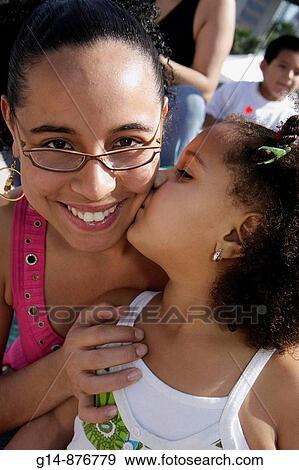 Florida, Miami, Little Havana, Jose Marti Park, United Hearts Family Festival, community event, Hispanic, woman, girl, mother, daughter, parent, child, biracial, curly heair, smiling, smile, eyegasses, kiss, kissing, View Large Photo Image Stock Photo - Florida, Miami, Little Havana, Jose Marti Park, United Hearts Family Festival, community event, Hispanic, woman, girl, mother, daughter, parent, child, biracial, curly heair, smiling, smile, eyegasses, kiss, kissing,. Fotosearch