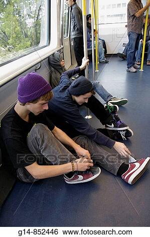 Florida, Miami, Metromover, people mover system, public transportation, boy, boys, teen, student, sitting on floor, urban streetwear, View Large Photo Image Stock Photograph - Florida, Miami, Metromover, people mover system, public transportation, boy, boys, teen, student, sitting on floor, urban streetwear,. Fotosearch