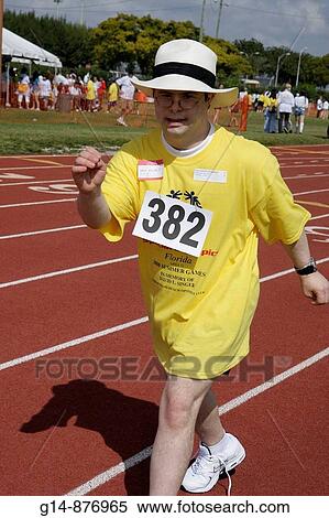 Florida, Miami, Miami Dade College, North Campus, Special Olympics, disabled, competition, sports, athlete, student, volunteer, acceptance, man, track and field, race, runner, race, hat, untied shoelace, Down Syndrome, View Large Photo Image Stock Photography - Florida, Miami, Miami Dade College, North Campus, Special Olympics, disabled, competition, sports, athlete, student, volunteer, acceptance, man, track and field, race, runner, race, hat, untied shoelace, Down Syndrome,. Fotosearch