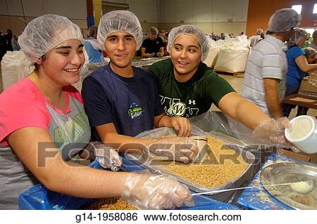 Florida, Miami, Miami-Dade County Fair And Expo, Feed My Starving Children, volunteer, community service, packing, meals, hairnet, Hispanic, teen, girl, student,. View Large Photo Image Stock Photograph - Florida, Miami, Miami-Dade County Fair And Expo, Feed My Starving Children, volunteer, community service, packing, meals, hairnet, Hispanic, teen, girl, student,.. Fotosearch
