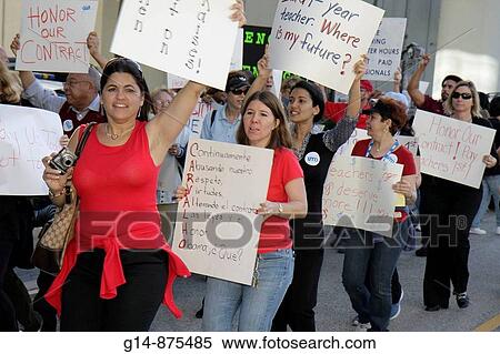 Stock Photography - Florida, Miami, School Board Administration Building, education, budget cuts, economy, salary raise, pay, contract, money, teacher, teachers, professional, job, underpaid, protest, sign, Hispanic, Black, woman, man, multi racial crowd, free speech,. Fotosearch