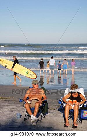 Florida, New Smyrna Beach, Flagler Avenue Beach, Atlantic Ocean, public beach, seashore, waves, woman, man, boy, girl, couple, family,, wade, wading, surfer, surfboard, beach chair, readi, relax, sunbathe, reflection, surf, View Large Photo Image Stock Image - Florida, New Smyrna Beach, Flagler Avenue Beach, Atlantic Ocean, public beach, seashore, waves, woman, man, boy, girl, couple, family,, wade, wading, surfer, surfboard, beach chair, readi, relax, sunbathe, reflection, surf,. Fotosearch