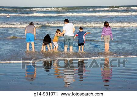Florida, New Smyrna Beach, Flagler Avenue Beach, Atlantic Ocean, public beach, seashore, waves, woman, boy, girl, teen, family,, wade, wading, reflection, surf, View Large Photo Image Stock Image - Florida, New Smyrna Beach, Flagler Avenue Beach, Atlantic Ocean, public beach, seashore, waves, woman, boy, girl, teen, family,, wade, wading, reflection, surf,. Fotosearch