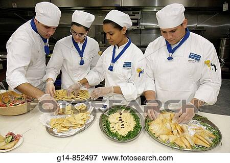 Florida, North Miami, Johnson and Wales Univeristy, Open House, Culinary Arts, student, school, hospitality, career, chef coat, necktie, skullcap, cooking, kitchen, hummus, Mediterranean food, pita, Hispanic, man, woman, food, display, View Large Photo Image Stock Photo - Florida, North Miami, Johnson and Wales Univeristy, Open House, Culinary Arts, student, school, hospitality, career, chef coat, necktie, skullcap, cooking, kitchen, hummus, Mediterranean food, pita, Hispanic, man, woman, food, display,. Fotosearch