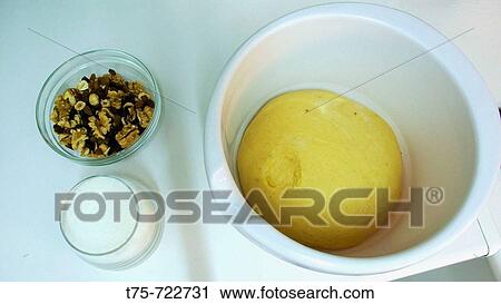 Stock Image - Flour dough, sugar, nuts. Fotosearch