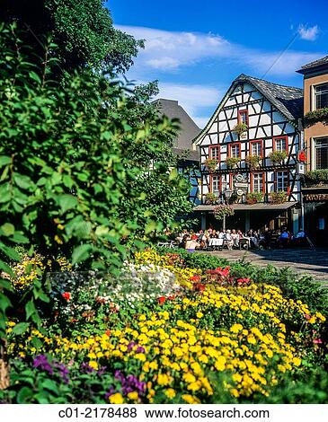 Flower bed and cafe terrace and half-timbered house Bad Neuenahr-Ahrweiler Rhineland-Palatinate Germany. View Large Photo Image Stock Photo - Flower bed and cafe terrace and half-timbered house Bad Neuenahr-Ahrweiler Rhineland-Palatinate Germany.. Fotosearch