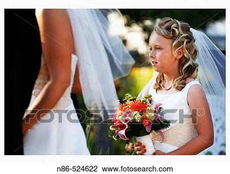 Flower girl with bride and groom View Large Photo Image Stock Image - Flower girl with bride and groom. Fotosearch