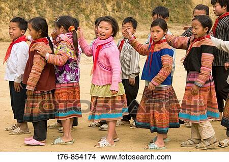 Flower Hmong schoolgirls playing in Cau Son near Bac Ha Vietnam View Large Photo Image Picture - Flower Hmong schoolgirls playing in Cau Son near Bac Ha Vietnam. Fotosearch