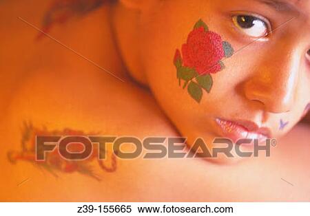 Flower tattoo on cheek. View Large Photo Image Stock Photography - Flower tattoo on cheek.. Fotosearch