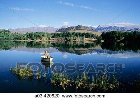 Fly Fishing for trout, Lake Naverone, Drakensberg, South Africa View Large Photo Image Stock Image - Fly Fishing for trout, Lake Naverone, Drakensberg, South Africa. Fotosearch