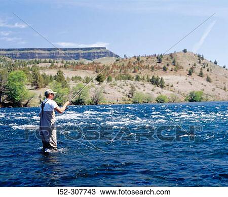 Stock Image - Fly fishing in Deschutes River. Oregon, USA. Fotosearch