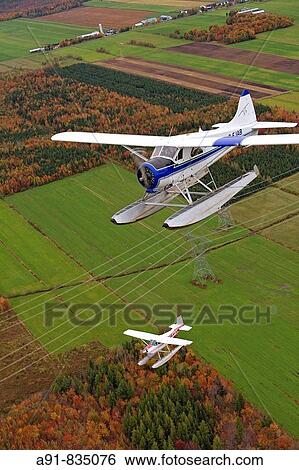 Flying over East counties in seaplane at fall, Quebec, Canada View Large Photo Image Stock Photograph - Flying over East counties in seaplane at fall, Quebec, Canada. Fotosearch