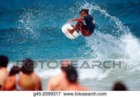 Flying with surfboard. View Large Photo Image Stock Photo - Flying with surfboard.. Fotosearch