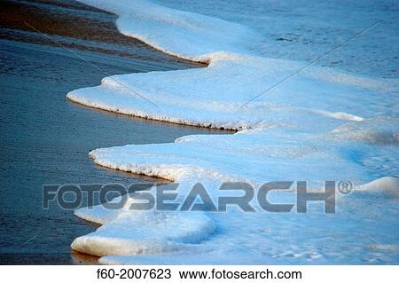 Foam from waves crashing in the shore, Waimea Bay, North Shore of Oahu, Hawaii, USA. View Large Photo Image Stock Image - Foam from waves crashing in the shore, Waimea Bay, North Shore of Oahu, Hawaii, USA.. Fotosearch