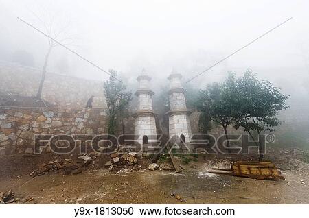 Fog covered pagodas at the San Huang Zhai Monastery on Song Mountain, China View Large Photo Image Stock Image - Fog covered pagodas at the San Huang Zhai Monastery on Song Mountain, China. Fotosearch