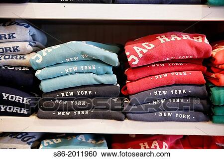 Folded and Stacked T-Shirts, Sag Harbor, Hamptons, Long Island, New York, USA, Displayed in a Souvenir Store. View Large Photo Image Stock Image - Folded and Stacked T-Shirts, Sag Harbor, Hamptons, Long Island, New York, USA, Displayed in a Souvenir Store.. Fotosearch