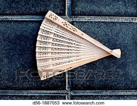 Stock Image - folding fan on the floor, Valencia, Spain. Fotosearch