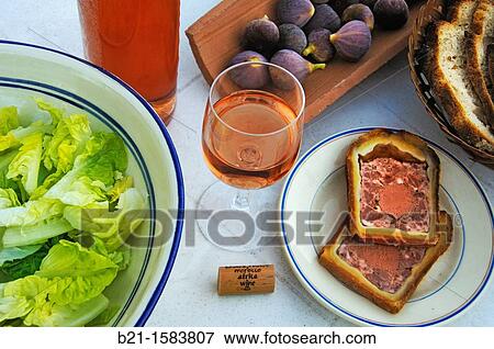 Stock Photo - Food: green salad and pat?, figs and bread with wine from Africa. Fotosearch