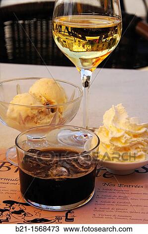 Food: ice cream of vanilla with raisin, ice coffee, white sweet wine from Gascony and Chantilly cream, Nogaro, Gers, Midi-Pyrenees, France View Large Photo Image Stock Image - Food: ice cream of vanilla with raisin, ice coffee, white sweet wine from Gascony and Chantilly cream, Nogaro, Gers, Midi-Pyrenees, France. Fotosearch
