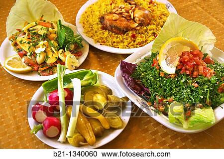 Stock Image - Food: mushroom salad, pickles, chicken with rice and taboule. Damascus, Syria. Fotosearch